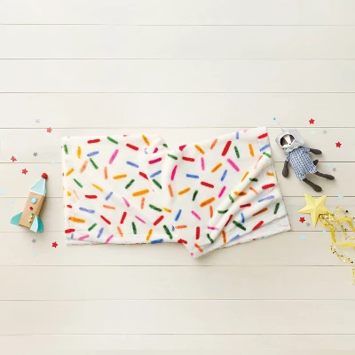 50"x60" Holiday Sprinkles Fuzzy Kids' Throw Blanket White - Pillowfort™ 1 50"x60" Holiday Sprinkles Fuzzy Kids' Throw Blanket White - Pillowfort™